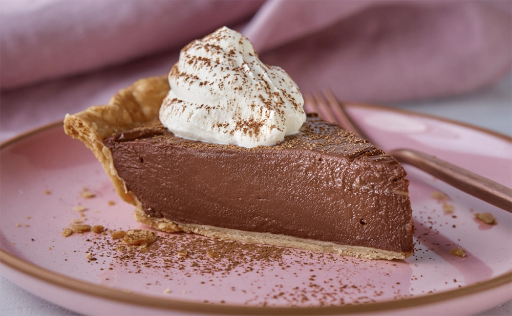 Homemade choco pie with shiny chocolate coating and soft marshmallow filling.