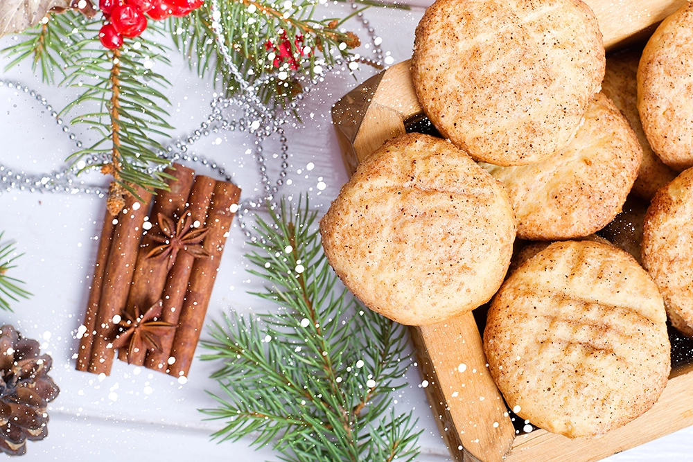 Christmas Snickerdoodle Cookies decorated with red and green sugar on a holiday platter.