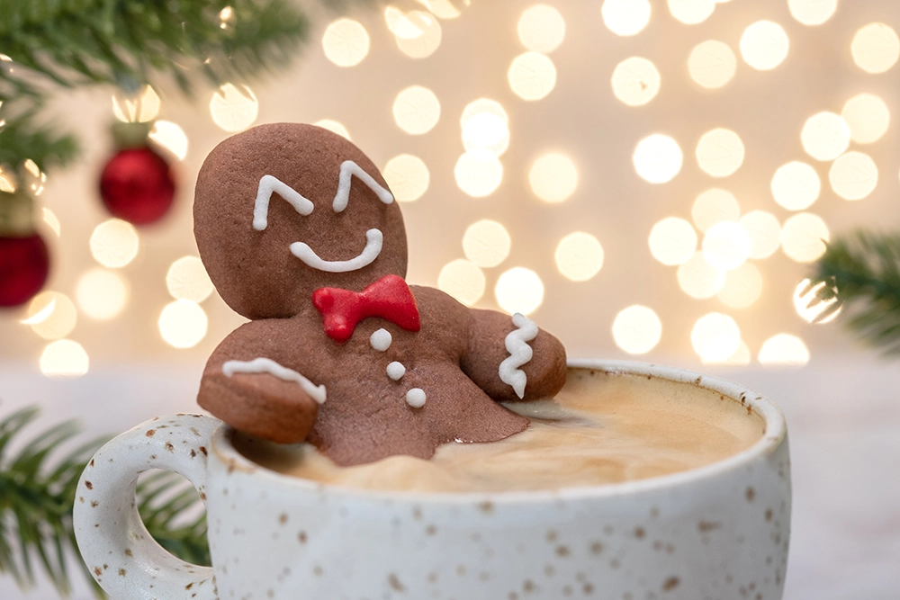 Decorated gingerbread men Christmas cookies with icing and candies on a holiday plate.